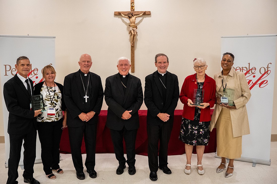 Bishop Chad W. Zielinski of New Ulm, Minn., third from left, Bishop Daniel E. Thomas of Toledo, Ohio, chairman of the U.S. Catholic bishops' Committee on Pro-Life Activities, and Bishop Michael F. Burbidge of Arlington, Va., are pictured with the "People of Life" recipients in Arlington Aug. 11, 2025. Pictured are Daniel Marker and Susan Young, receiving the award posthumously for their parents, Mike and Rita Marker of Steubenville, Ohio; Judy Haag of Eden Valley, Minn.; and Valerie Washington of Baltimore, executive director of the National Black Catholic Congress. (OSV News photo/Jim Hale, courtesy Arlington Catholic Herald) Editors: This cutline has been corrected to identify the U.S. bishops' pro-life chair.