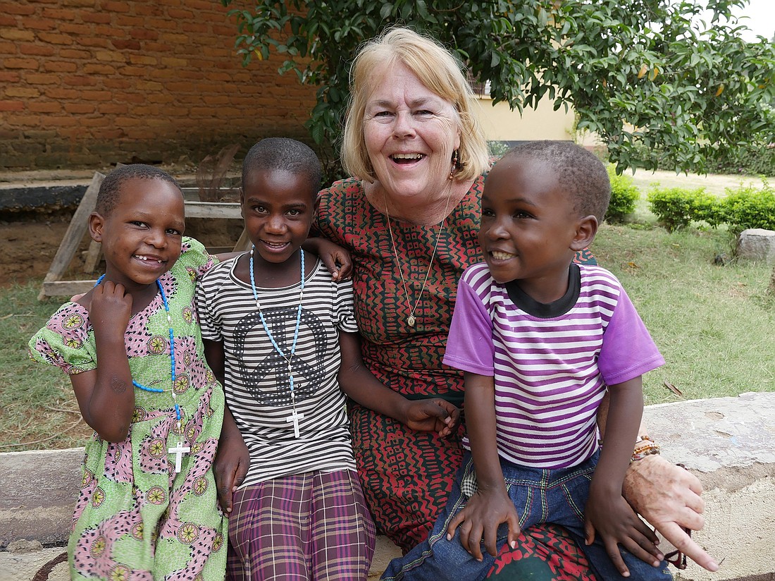 Elizabeth Mach, a Maryknoll Lay Missioner, poses with children at the Jipe Moyo center in Musoma, Tanzania, in an undated photo. Mach's work supports the center, which cares for children who have been living on the street or have been abused. (OSV News hoto/Sean Sprague, courtesy Maryknoll)