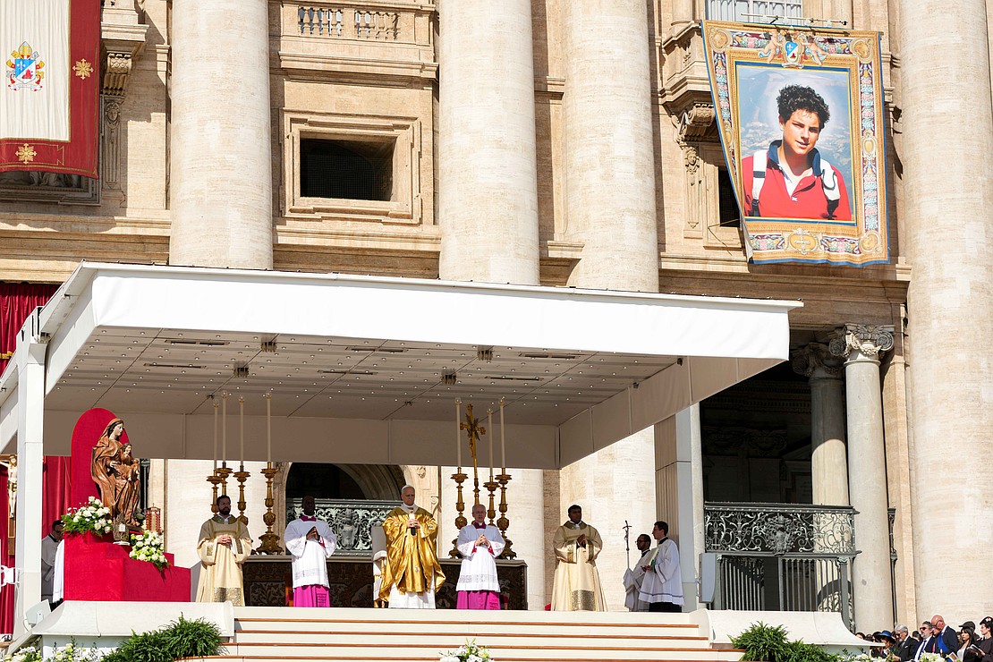 Pope Leo XIV celebrates Mass in St. Peter’s Square at the Vatican for the canonizations of Sts. Pier Giorgio Frassati and Carlo Acutis Sept. 7, 2025. A tapestry with the image of Carlo Acutis hangs from St. Peter’s Basilica during the liturgy. (CNS photo/Lola Gomez)
