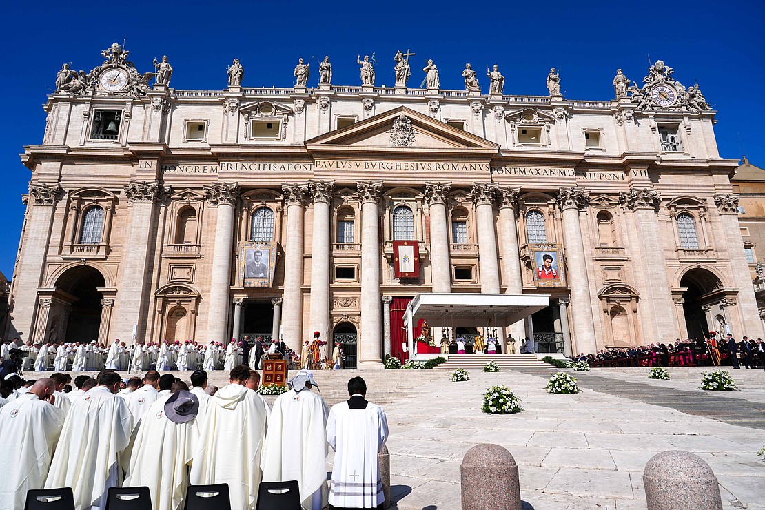 Pope Leo XIV celebrates the Mass for the canonization of Sts. Pier Giorgio Frassati and Carlo Acutis in St. Peter’s Square at the Vatican Sept. 7, 2025. Banners with the images of the two new saints hang from the facade of St. Peter’s Basilica. (CNS photo/Lola Gomez)
