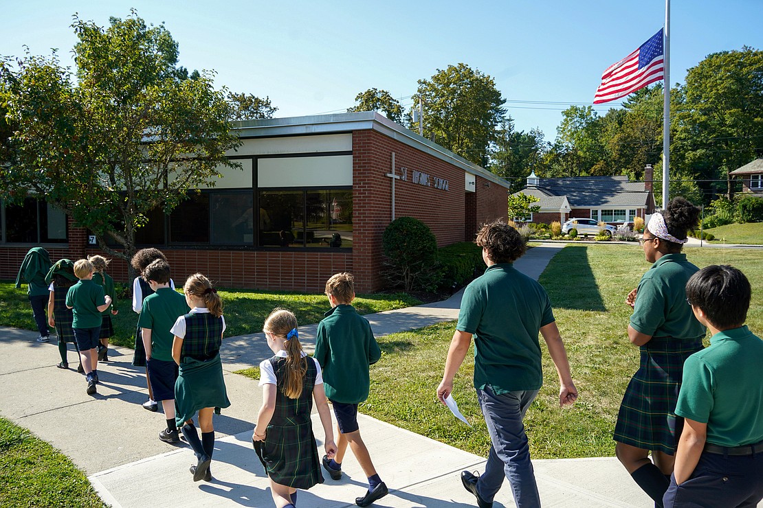 Students walk from the church to the school after Mass on Sept. 11 at St. Thomas the Apostle School in Delmar. (Cindy Schultz photo for The Evangelist)