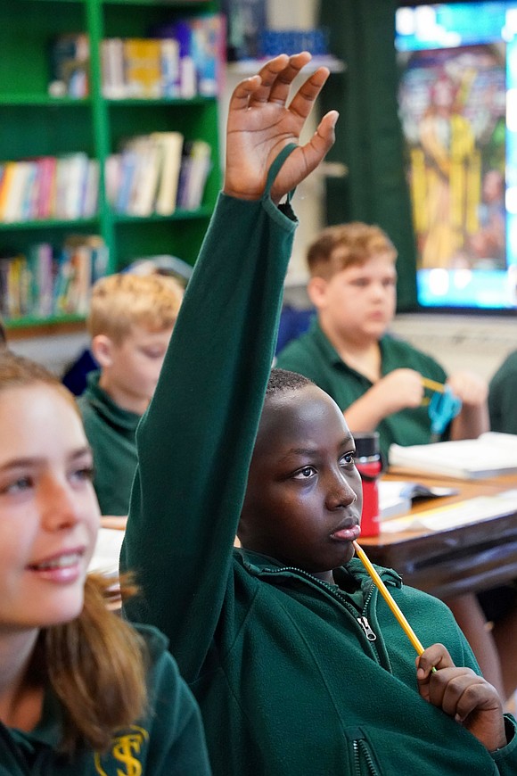 Elijah Huruma knows the answer during fifth-grade math class on Sept. 11 at St. Thomas the Apostle School in Delmar. (Cindy Schultz photo for The Evangelist)