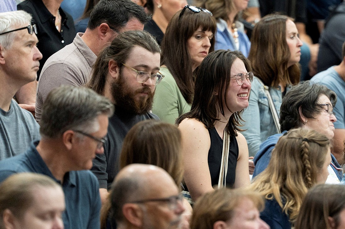 A woman reacts during a prayer vigil at the Academy of Holy Angels following a shooting earlier in the day at Annunciation Church in Minneapolis Aug. 27, 2025. A shooter opened fire with a rifle through the windows of the school's church and struck children attending Mass during the first week of school, killing two and wounding 21 people in an act of violence the police chief called "absolutely incomprehensible." (OSV News photo/Tim Evans, Reuters)