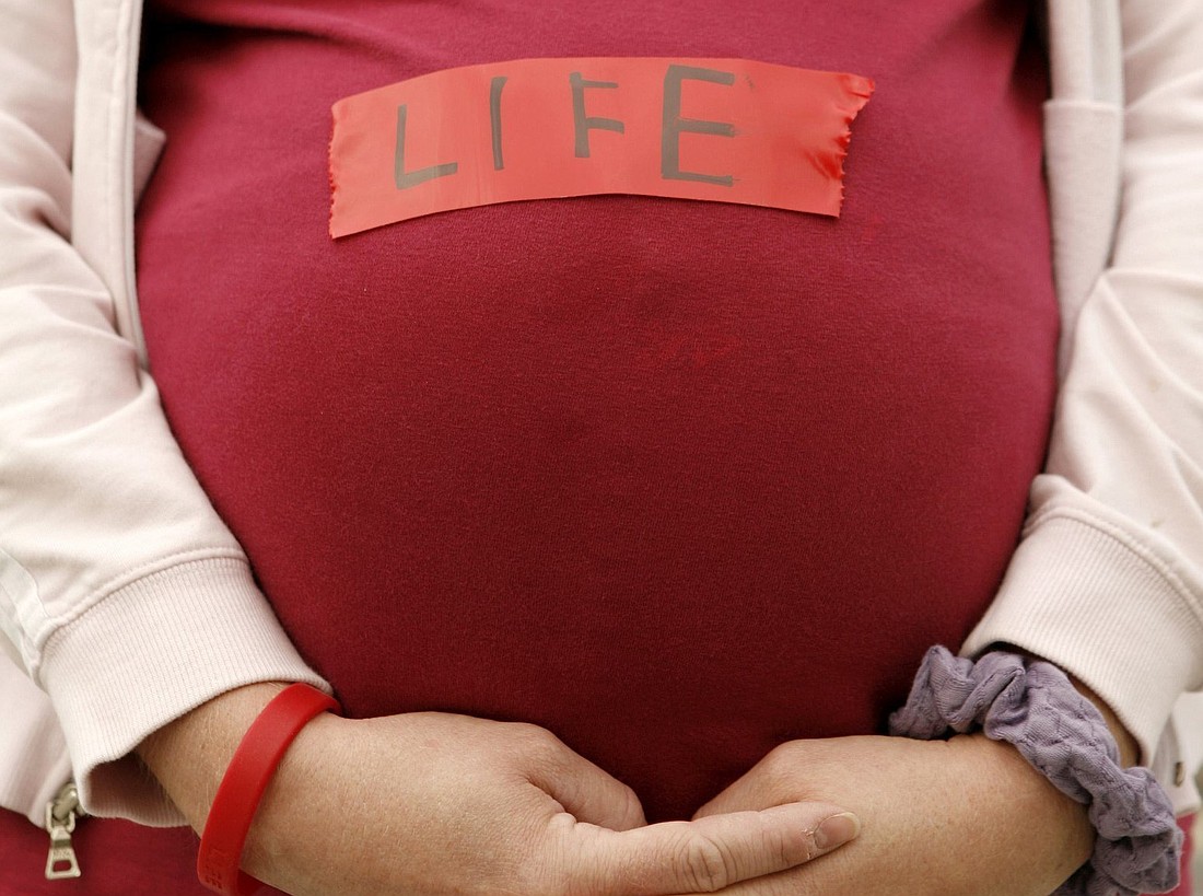 A pregnant pro-life demonstrator is pictured in a file photo. (OSV News photo/Kevin Lamarque, Reuters)
