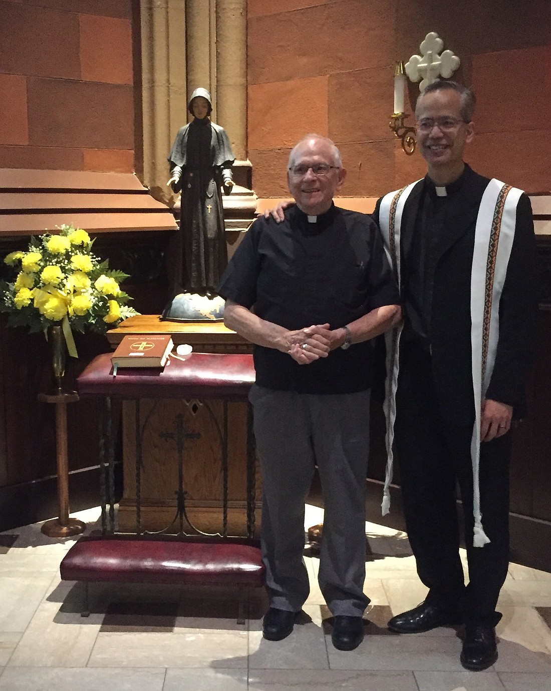 Cap: Father Robert Hohenstein is shown with Father Rendell Torres in front of the statue of St. Elizabeth Ann Seton, which now resides at the Cathedral of the Immaculate Conception in Albany. (Photo courtesy of Father Hohenstein)