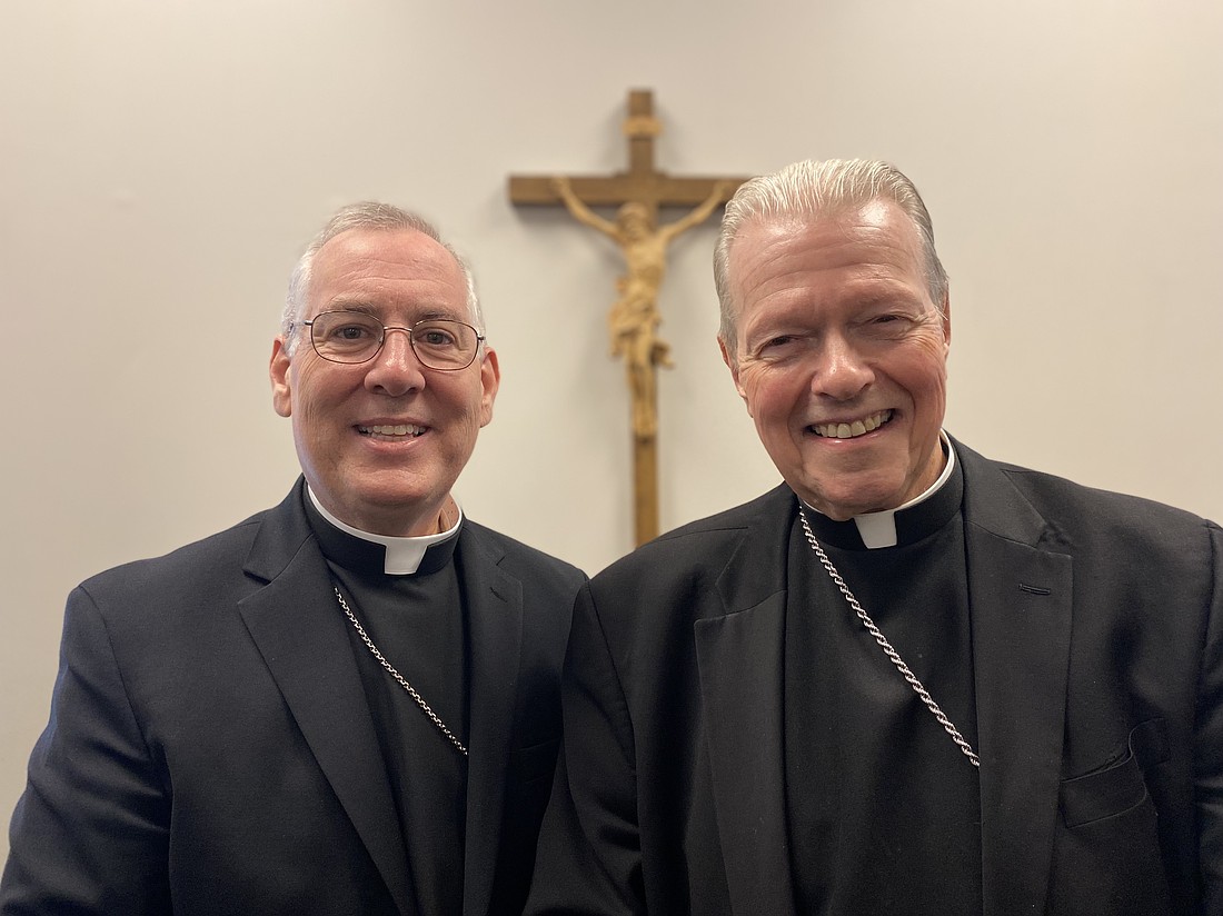 Bishop Edward B. Scharfenberger (r.) welcomes Bishop Mark O’Connell, who was named the 11th Bishop of Albany on Oct. 20, to the Diocese and said in a letter to the faithful that “I wanted him to know my desire to assist him pastorally and in any other way as he may request, since it has always been my wish to remain and to serve in the Diocese of Albany after retirement.” (Kathy Barrans photo)