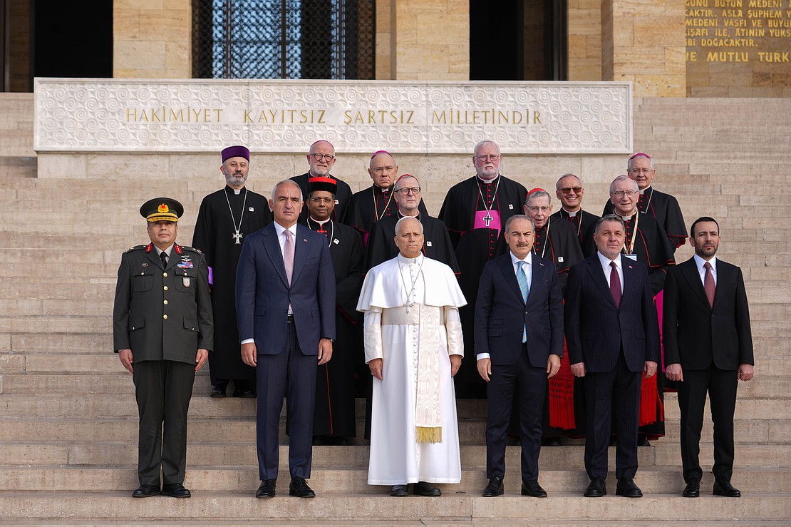 Pope Leo XIV poses for a group photo with Turkish officials and members of the pope's entourage on the steps of the mausoleum of Mustafa Kemal Atatürk in Ankara, Turkey, Nov. 27, 2025. The visit marked the beginning of the pope’s apostolic journey to Turkey and Lebanon. (CNS photo/Lola Gomez)