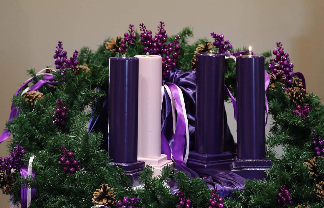 The Advent season began this year on Nov. 30 with the lighting of the Advent wreath as the central symbolic rite of spiritual preparation for Christmas. Purple is the color of penitence and humility. The rose colored candle, lit the Third Week of Advent, represents a hopeful look toward Christ's coming. (OSV News photo/Bob Roller)