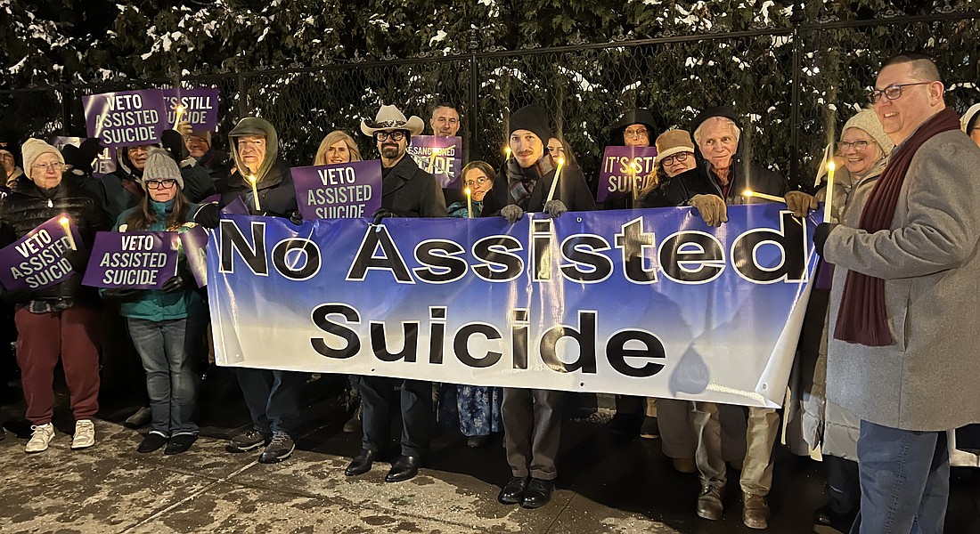 Opponents of New York State's proposed assisted suicide bill stood outside the Governor's Mansion on Wednesday, Dec. 3, for a candlelight vigil advocating for Gov. Kathy Hochul to veto the legislation. (Emily Benson photo)