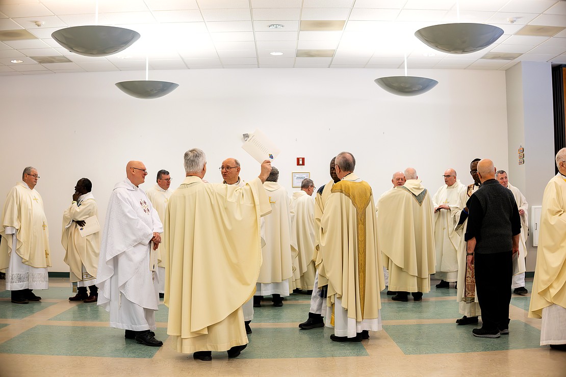 Priests, deacons and bishop get vested before the Installation of Bishop Mark O'Connell at St. Edward the Confessor in Clifton Park on Friday, December 5, 2025. (Patrick Dodson photo)