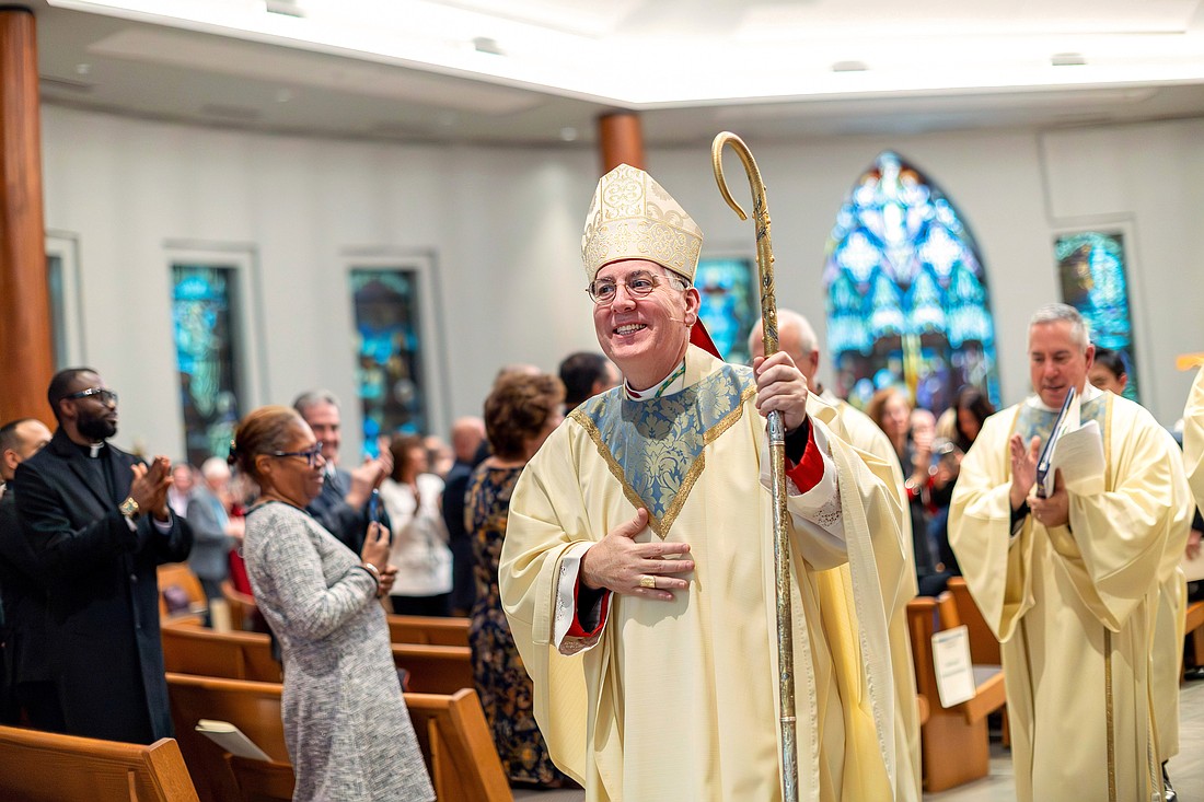 Bishop Mark O'Connell processes out of St. Edward the Confessor in Clifton Park on Friday, December 5, 2025. (Patrick Dodson photo)