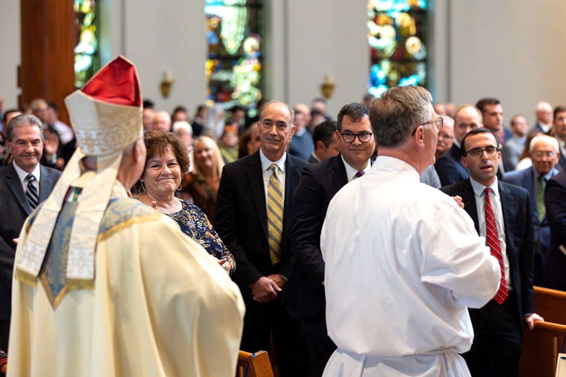 Bishop Mark W. O'Connell processes into St. Edward the Confessor in Clifton Park on Friday, December 5, 2025, before his Installation Mass. (Patrick Dodson photo)