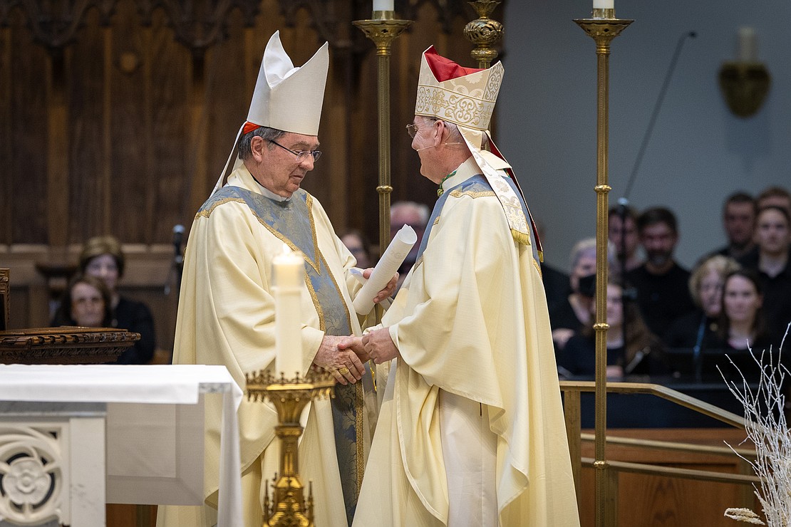 Cardinal Christophe Pierre, Apostolic Nuncio to the United States, hands Bishop Mark O'Connell the Apostolic Mandate, which names him the 11th Bishop of Albany. (Dino Petrocelli photo for The Evangelist)