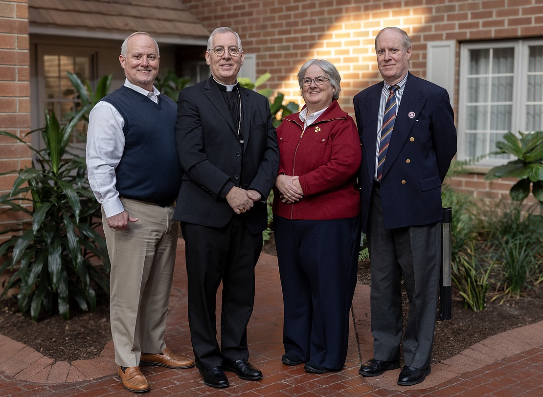 After brunch at the Desmond Hotel in Albany, Bishop Mark O'Connell takes a photo with his brothers, Tom (at r.) and John Marion, and sister, Mary Margaret. (Dino Petrocelli photo for The Evangelist)