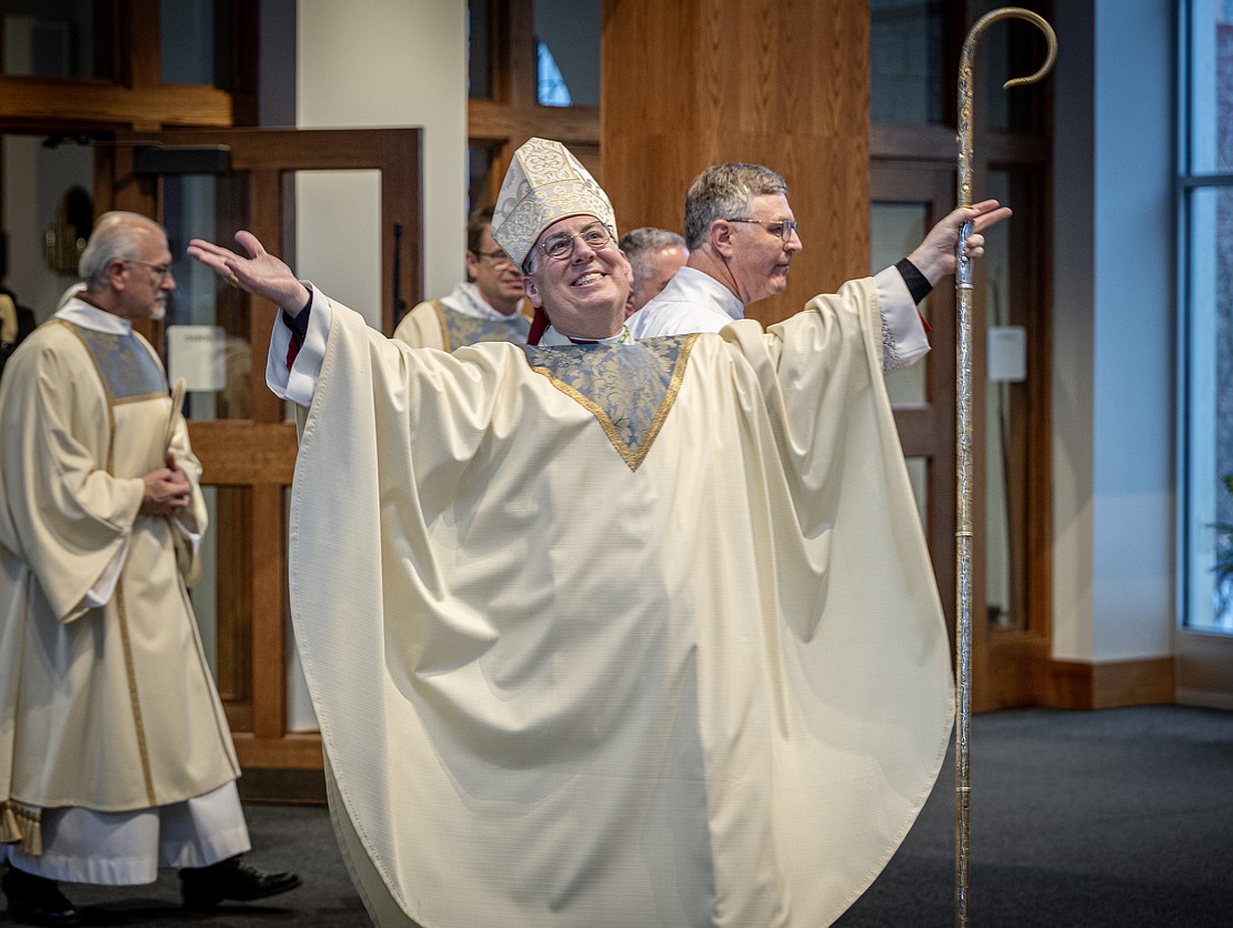 A joyful Bishop Mark O'Connell leaves the church after his Installation Mass on Dec. 5. (Dino Petrocelli photo for The Evangelist)