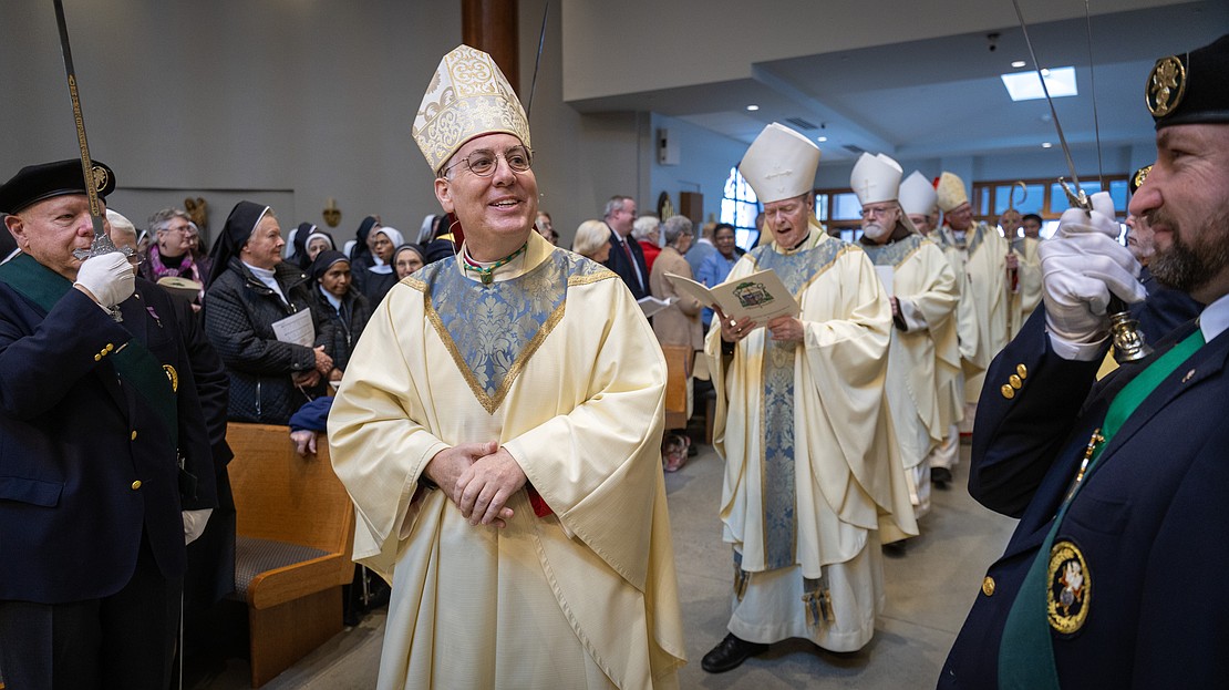 Bishop Mark O'Connell processes into St. Edward the Confessor Church during his Installation Mass. (Dino Petrocelli photos for The Evangelist)
