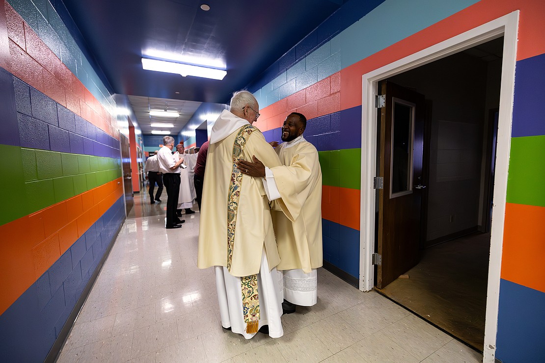 St. Edward the Confessor Church was a din of activity - priests and bishops getting vested, old friendships were renewed, and there were lots of hugs and lots of work still to be done - prior to Bishop Mark O'Connell's Installation Mass. (Patrick Dodson photo for The Evangelist)