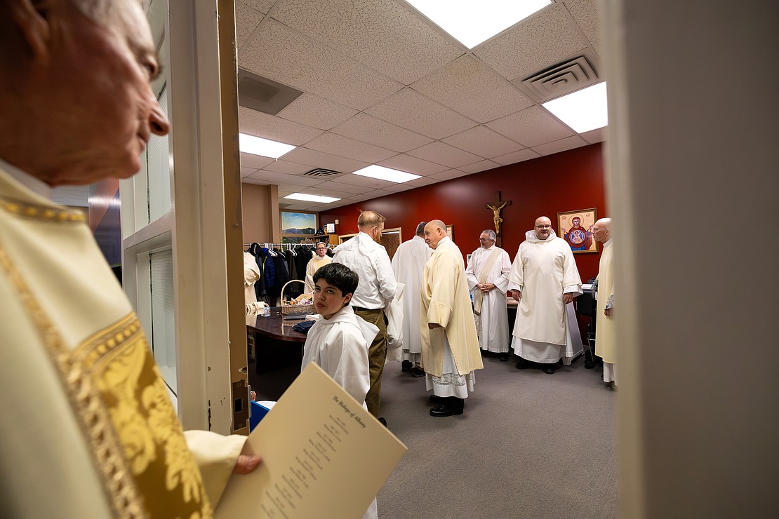 St. Edward the Confessor Church was a din of activity - priests and bishops getting vested, old friendships were renewed, and there were lots of hugs and lots of work still to be done - prior to Bishop Mark O'Connell's Installation Mass. (Patrick Dodson photo for The Evangelist)