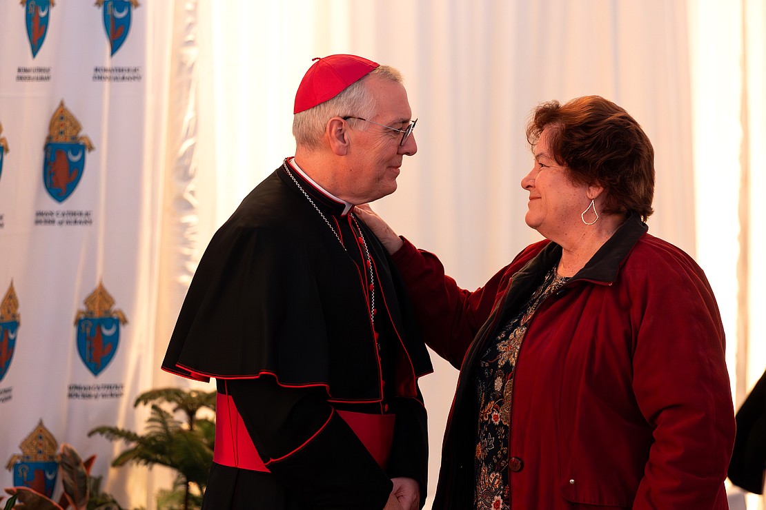 Bishop Mark O'Connell meet with the faithful in a heated tent after his Installation Mass on Dec. 5. (Patrick Dodson photo for The Evangelist)