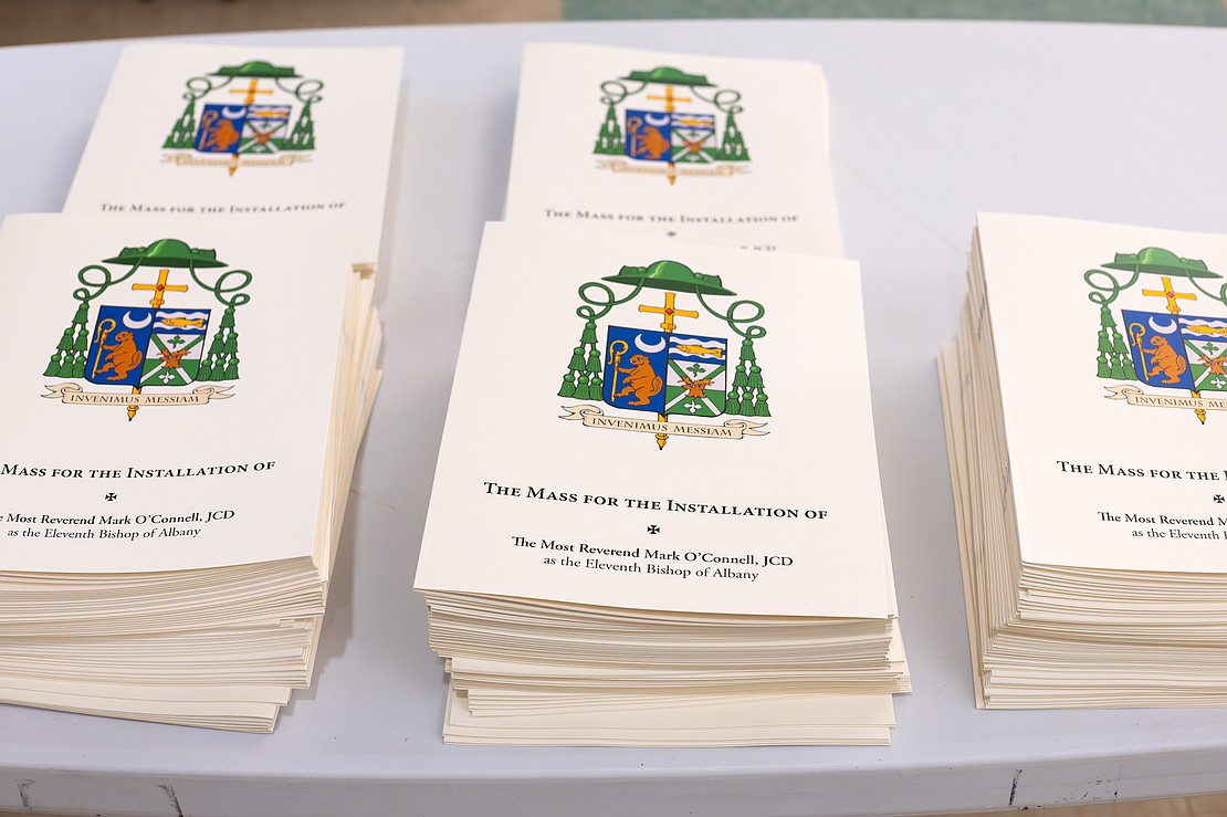 St. Edward the Confessor Church was a din of activity - priests and bishops getting vested, old friendships were renewed, and there were lots of hugs and lots of work still to be done - prior to Bishop Mark O'Connell's Installation Mass. (Patrick Dodson photo for The Evangelist)