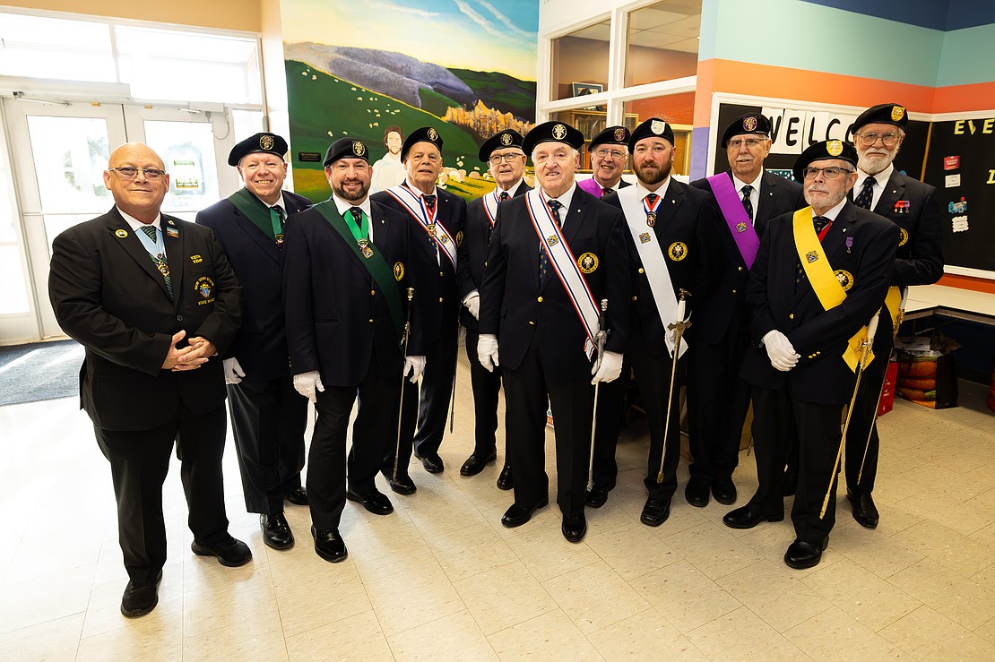 St. Edward the Confessor Church was a din of activity - priests and bishops getting vested, old friendships were renewed, and there were lots of hugs and lots of work still to be done - prior to Bishop Mark O'Connell's Installation Mass. (Patrick Dodson photo for The Evangelist)