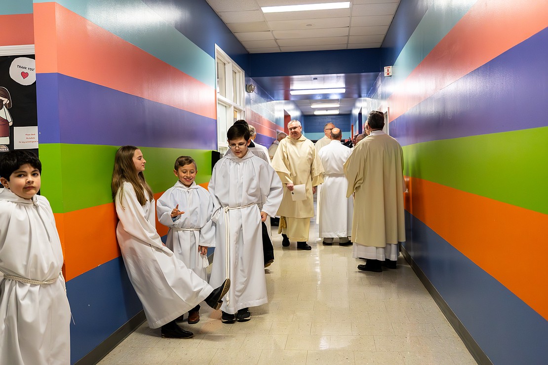 St. Edward the Confessor Church was a din of activity - priests and bishops getting vested, old friendships were renewed, and there were lots of hugs and lots of work still to be done - prior to Bishop Mark O'Connell's Installation Mass. (Patrick Dodson photo for The Evangelist)