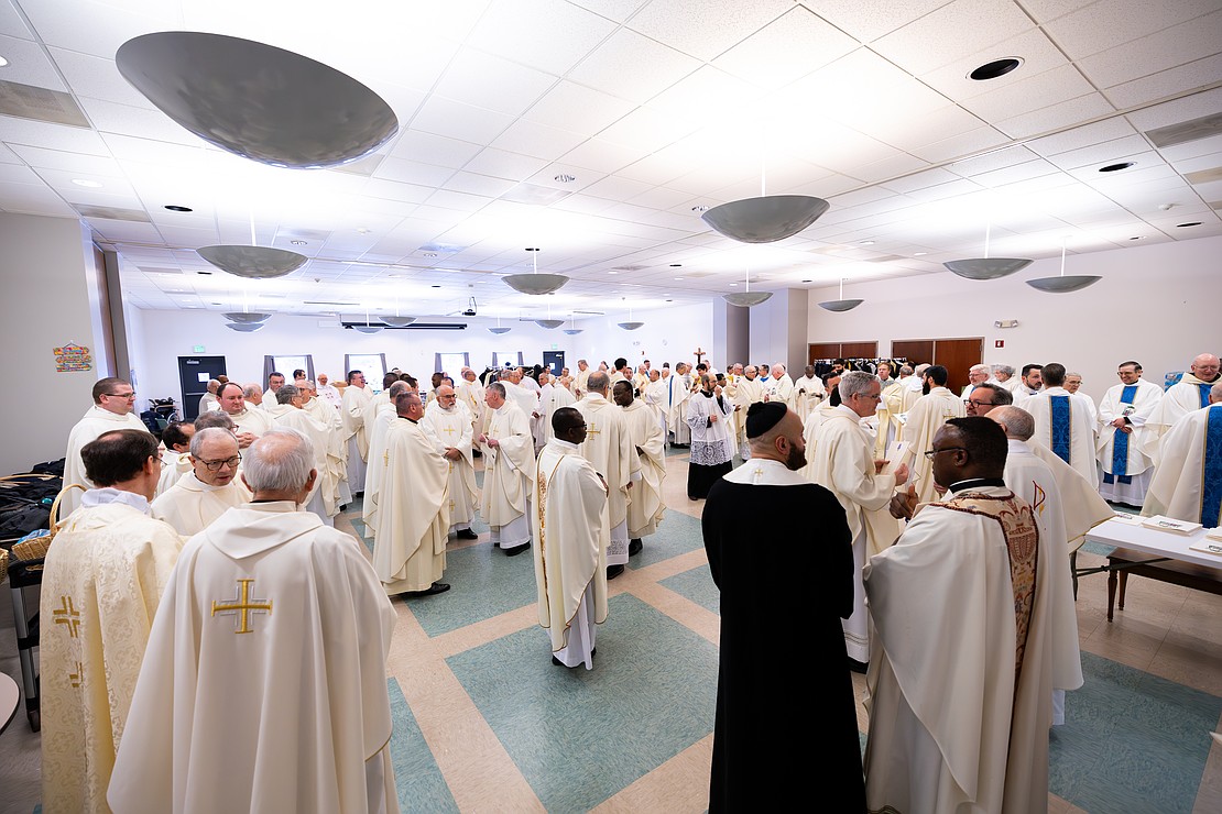 St. Edward the Confessor Church was a din of activity - priests and bishops getting vested, old friendships were renewed, and there were lots of hugs and lots of work still to be done - prior to Bishop Mark O'Connell's Installation Mass. (Patrick Dodson photo for The Evangelist)