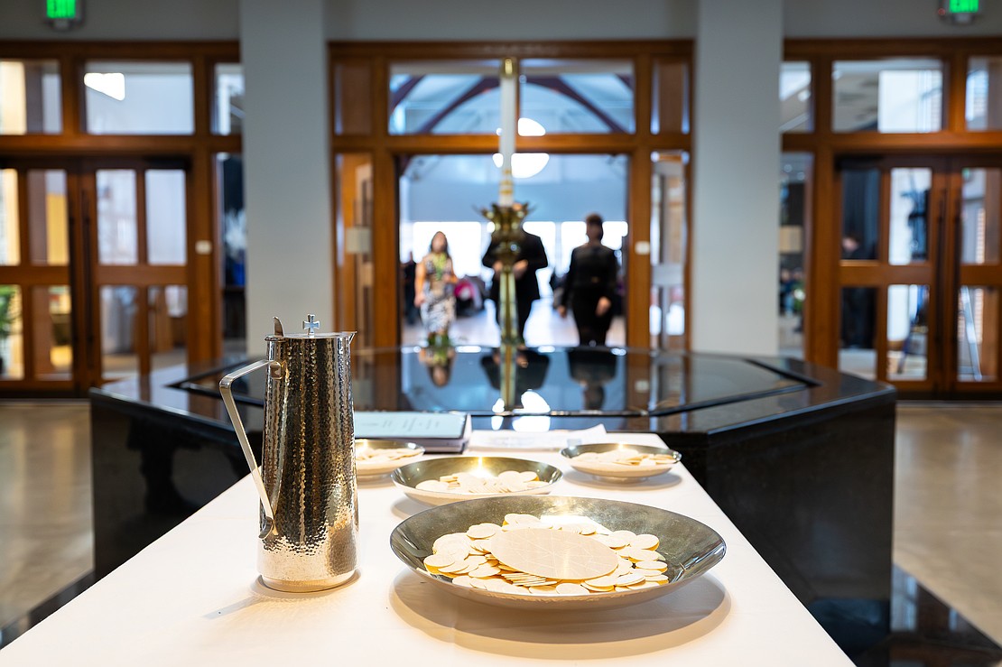 St. Edward the Confessor Church was a din of activity - priests and bishops getting vested, old friendships were renewed, and there were lots of hugs and lots of work still to be done - prior to Bishop Mark O'Connell's Installation Mass. (Patrick Dodson photo for The Evangelist)