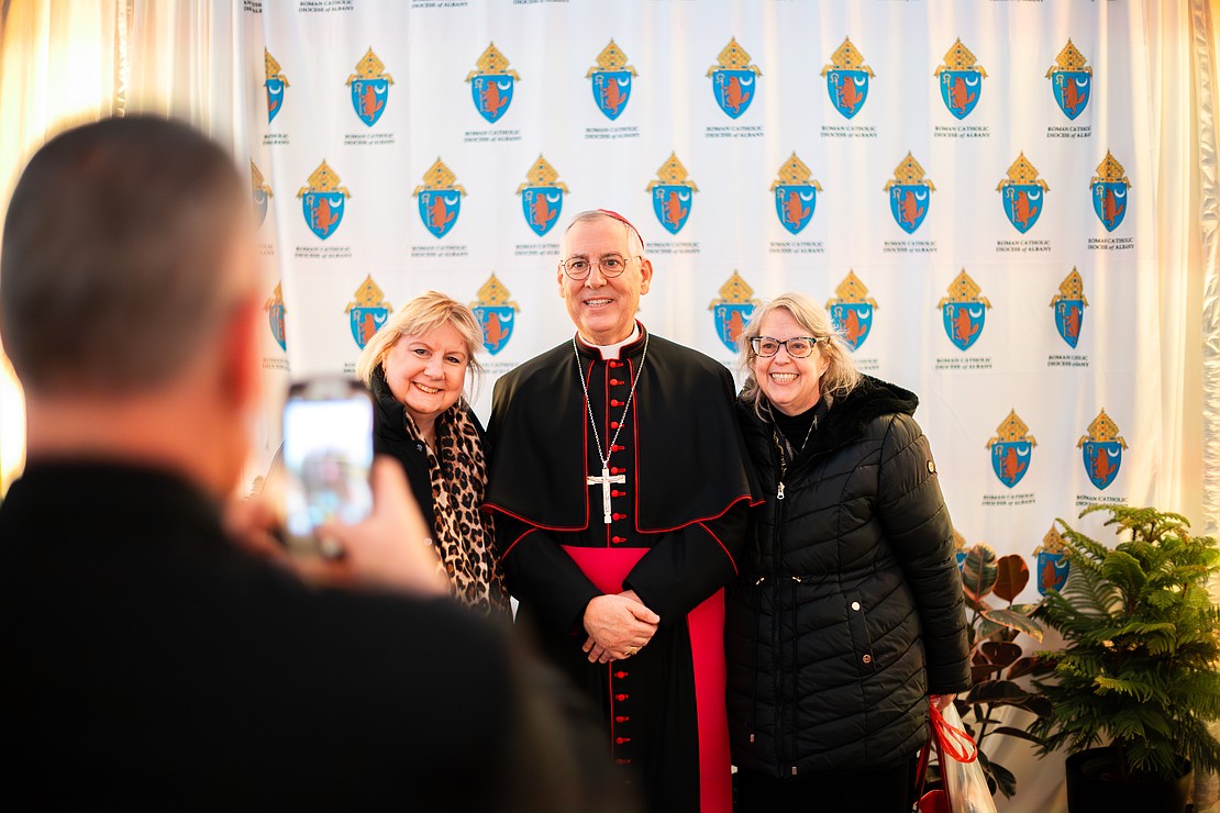 Bishop Mark O'Connell meet with the faithful in a heated tent after his Installation Mass on Dec. 5. (Patrick Dodson photo for The Evangelist)
