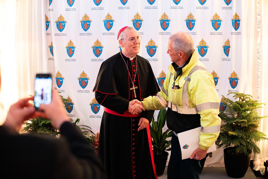Bishop Mark O'Connell meet with the faithful in a heated tent after his Installation Mass on Dec. 5. (Patrick Dodson photo for The Evangelist)