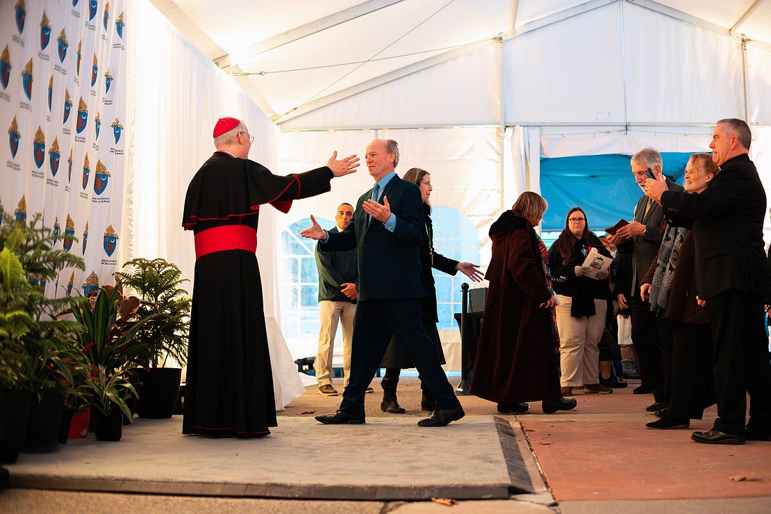 Bishop Mark O'Connell meet with the faithful in a heated tent after his Installation Mass on Dec. 5. (Patrick Dodson photo for The Evangelist)