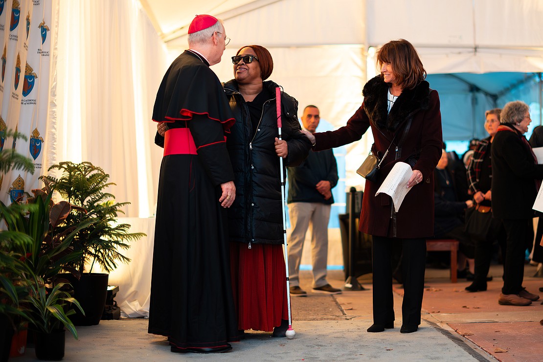 Bishop Mark O'Connell meet with the faithful in a heated tent after his Installation Mass on Dec. 5. (Patrick Dodson photo for The Evangelist)