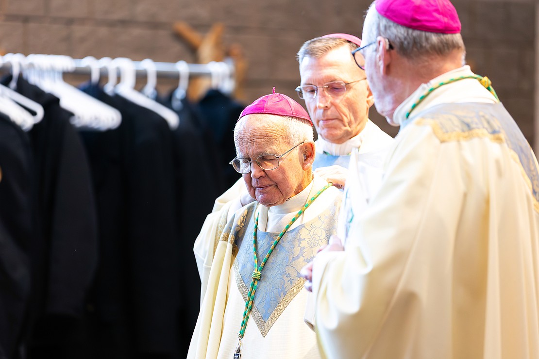 St. Edward the Confessor Church was a din of activity - priests and bishops getting vested, old friendships were renewed, and there were lots of hugs and lots of work still to be done - prior to Bishop Mark O'Connell's Installation Mass. (Patrick Dodson photo for The Evangelist)