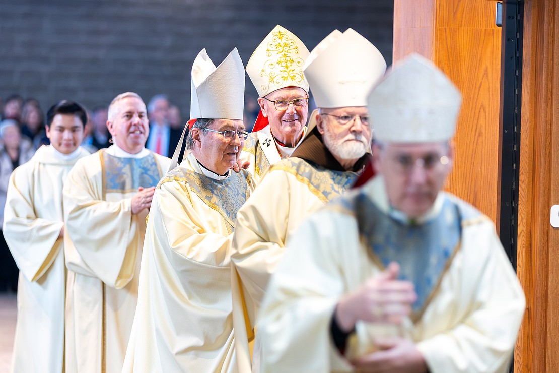 Civic leaders, honored guests, ecumenical leaders, deacons, priests, bishops and cardinals process into St. Edward the Confessor Church during Bishop Mark O'Connell's Installation Mass on Dec. 5. (Patrick Dodson photo for The Evangelist)