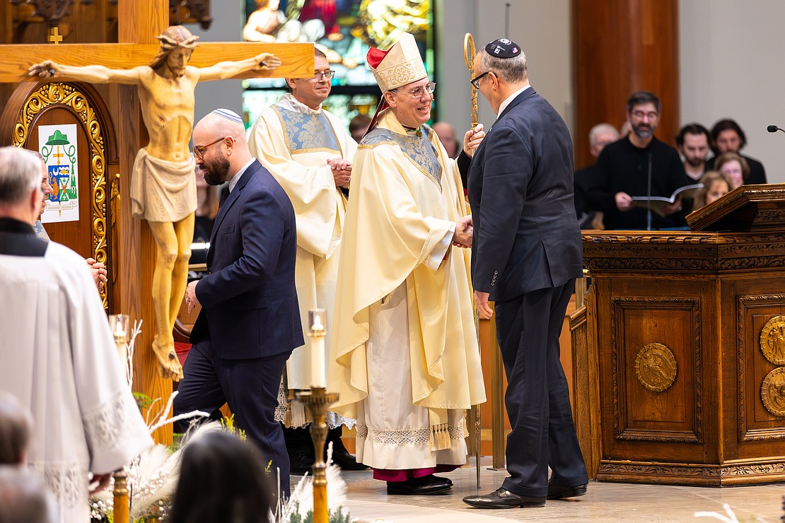 Bishop Mark O'Connell shakes hands with priests, bishops and ecumenical leaders after he is installed as the 11th Bishop of Albany. (Patrick Dodson photo for The Evangelist)