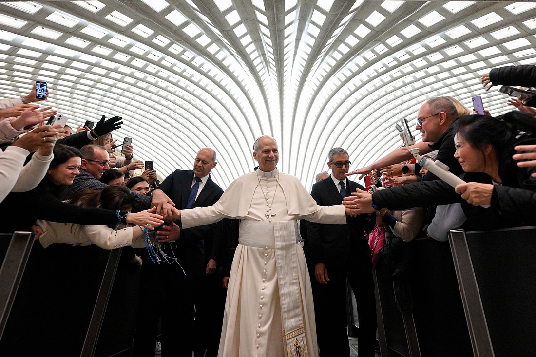 Pope Leo XIV greets people at the conclusion of his weekly general audience in the Paul VI Audience Hall at the Vatican Jan. 7, 2026. (CNS photo/Vatican Media)