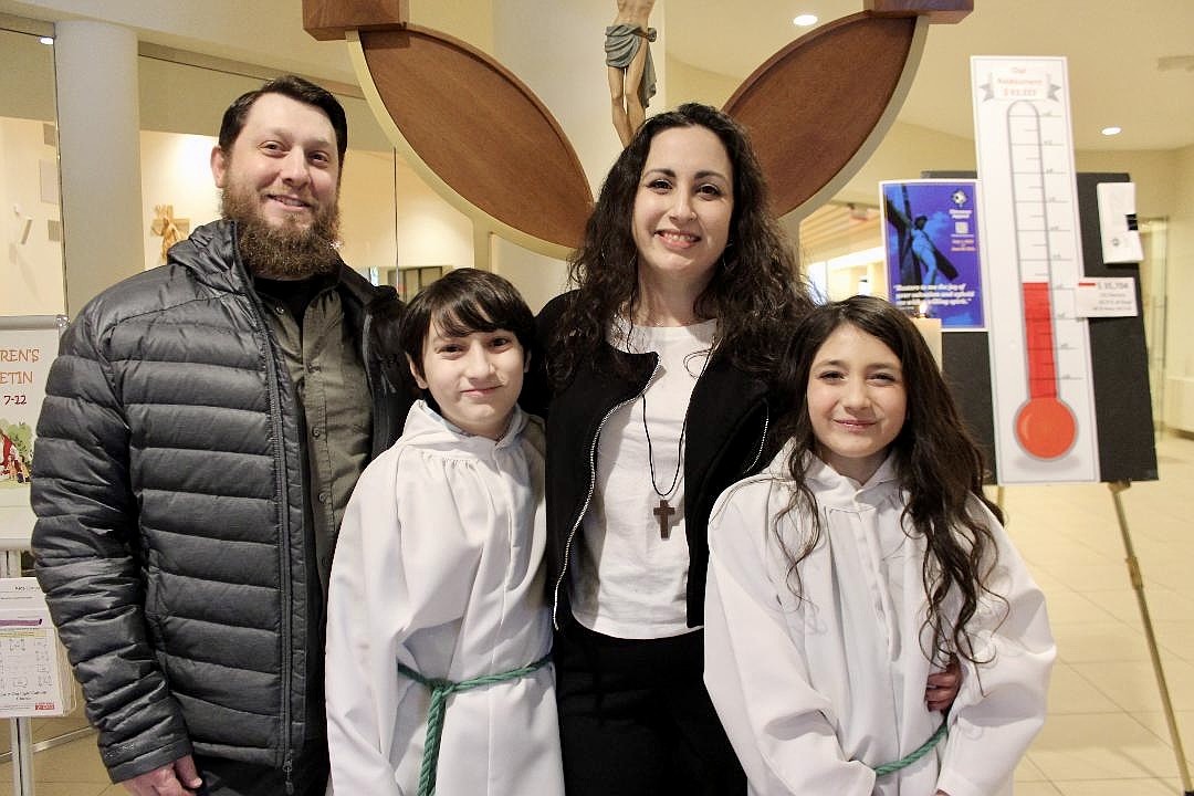 Kari Kurtz, a Pastoral Associate for Faith Formation at Christ Our Light and the Church of St. Clare’s, is shown with her husband Brian, who is Jewish, and their two children, Jackson and Victoria. (Photo provided)