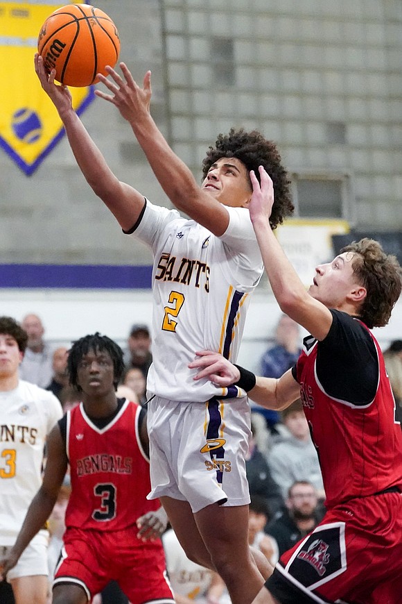 Spa Catholic’s Bryce Peterson, center, goes up for a shot during their basketball game against Tamarac on Friday, Jan. 9, 2026, at Saratoga Catholic Central School in Saratoga Springs, N.Y. Spa Catholic wins 63-58.  Cindy Schultz for The Evangelist