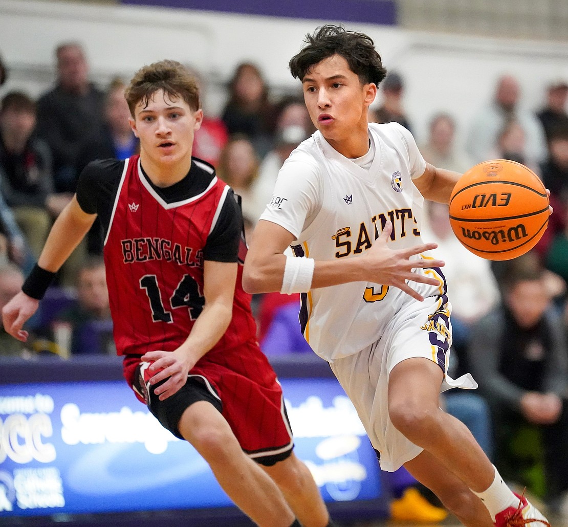Spa Catholic’s Kingston David, right, controls the ball as Tamarac’s Carter Harris defends during their basketball game on Friday, Jan. 9, 2026, at Saratoga Catholic Central School in Saratoga Springs, N.Y. Spa Catholic wins 63-58.  Cindy Schultz for The Evangelist