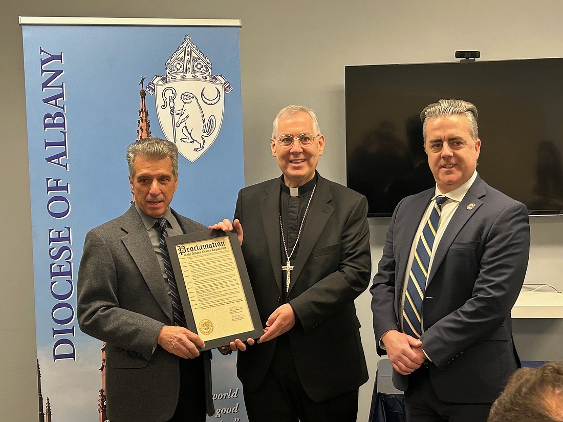 Bishop Mark O’Connell met with a delegation of Albany County legislators on Jan. 14 and received a proclamation welcoming him to the area and another proclamation for Bishop Emeritus Edward B. Scharfenberger recognizing his time as the head of the Diocese of Albany. (Mike Matvey photo)