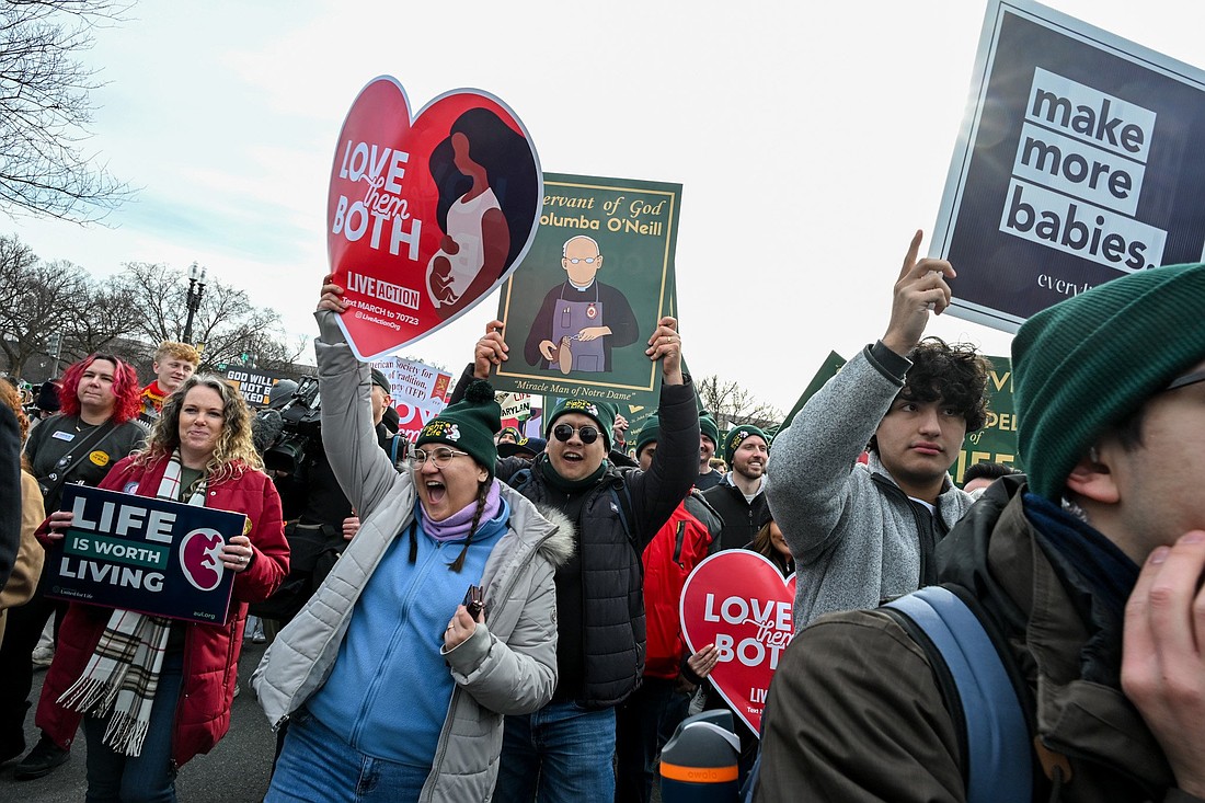Pro-life advocates hold signs during the 53rd annual March for Life in Washington Jan. 23, 2026. (OSV News photo/Leslie E. Kossoff).