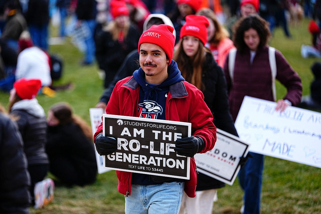 A young man carries a sign with other pro-life advocates during the 53rd annual March for Life in Washington Jan. 23, 2026. (OSV News photo/Aaron Schwartz, Reuters).