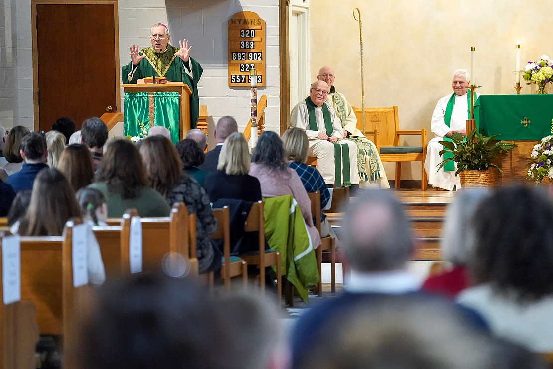 Bishop Mark O’Connell, left, draws smiles as he talks with students during the Catholic Schools mass on Friday, Jan. 23, 2026, at St. Jude the Apostle Church in Wynantskill, N.Y.  Cindy Schultz for The Evangelist