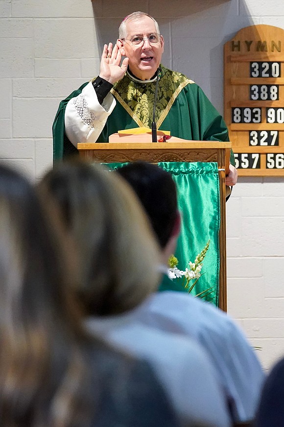 Bishop Mark O’Connell holds a hand to his ear as he waits for an answer to a question posed to students during the Catholic Schools mass on Friday, Jan. 23, 2026, at St. Jude the Apostle Church in Wynantskill, N.Y.  Cindy Schultz for The Evangelist