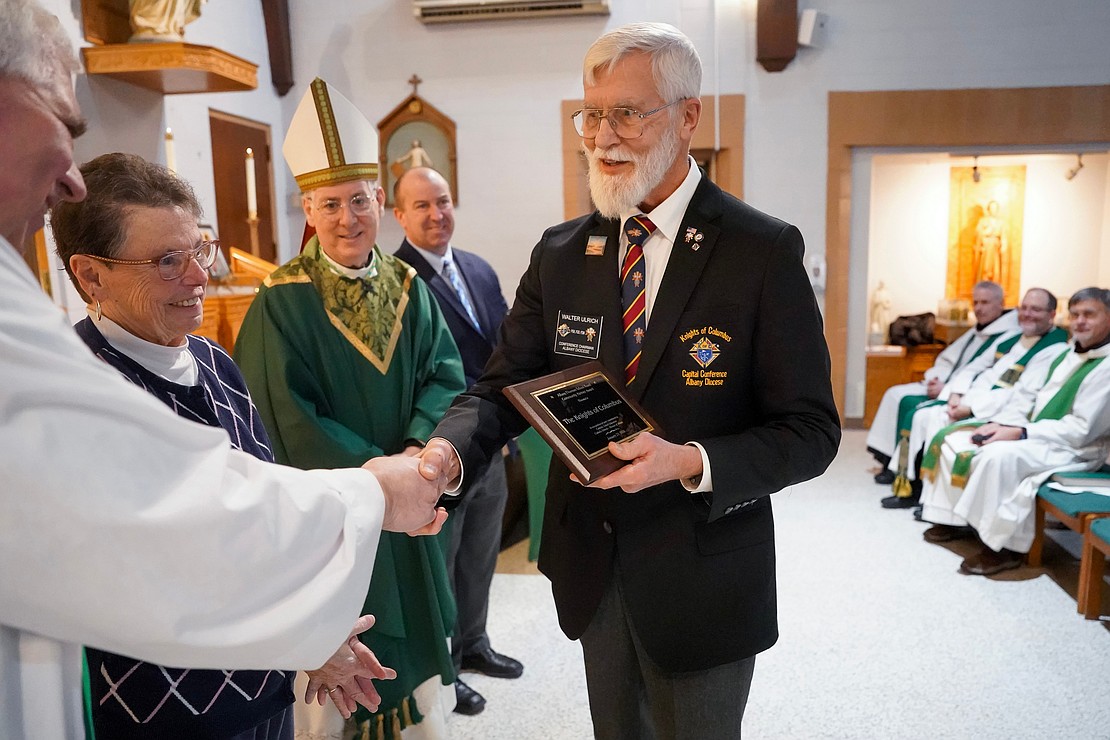 Walter Ulrich, Knights of Columbus chairman of the Capital Conference Officers, right, receives the Albany Diocesan School Board Community Partner Award during the Catholic Schools mass on Friday, Jan. 23, 2026, at St. Jude the Apostle Church in Wynantskill, N.Y.  Cindy Schultz for The Evangelist