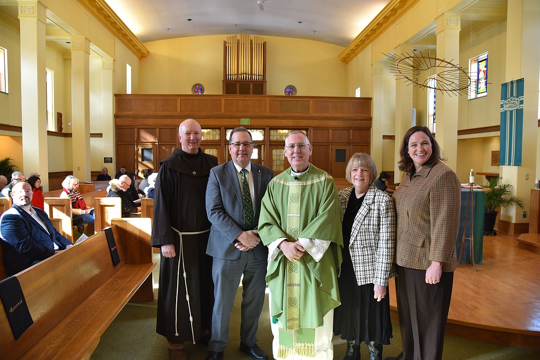 on Feb. 8, Bishop Mark O'Connell dedicated a new fully digital organ in Siena University’s St. Mary of the Angels Chapel. The Chapel has been without an organ for a few years, and the new instrument was made possible by a generous gift from Steve (’73) and Janeece Brophy. Bishop Mark is shown after Mass (from l.) with Father Mark Reamer, OFM, vice president for mission at Siena University, Chuck Seifert, president of Siena, Deb Seifert, and Anne McCarthy, dean of Siena’s School of Science. (Photo provided)