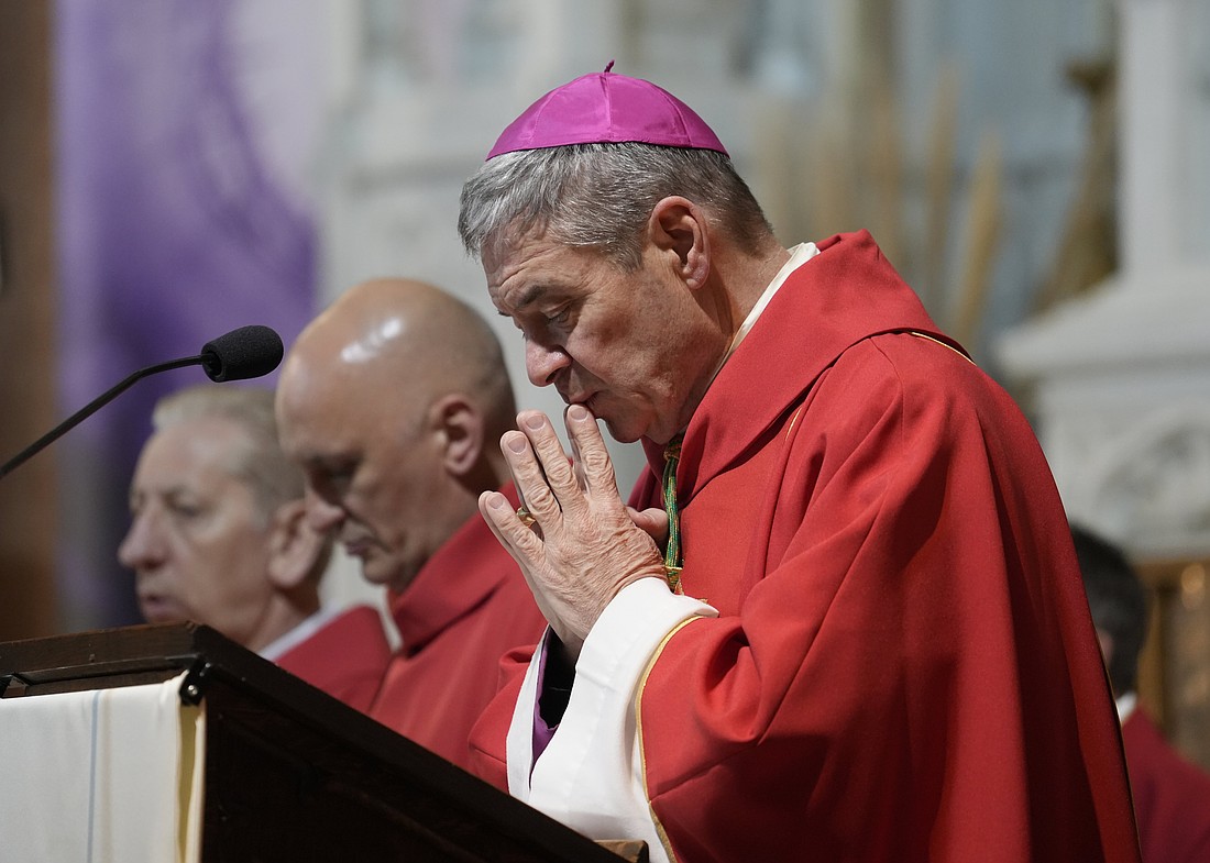 Bishop Robert J. Brennan of Brooklyn, N.Y., bows his head during a Mass dedicated to the memory of modern-day Christian martyrs at St. Rose of Lima Church in the Kensington section of Brooklyn April 7, 2025. (OSV News photo/Gregory A. Shemitz)