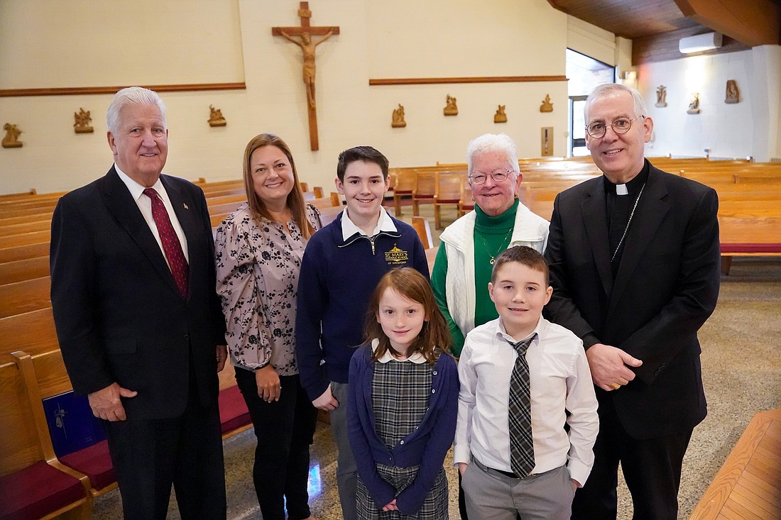 Former Albany Mayor Jerry Jennings (from l.) Principal Alexandra Morazan or St. Mary’s Waterford; student Jack Prechtl, 11; Mary Ellen Doyle Sochor, Bishop Mark O’Connell; and (front row from. l.) students Kateri Green, 8, and Finn Prechtl, 8, are shown during the first Father Kenneth J. Doyle Catholic Education Fund awards on March 3 at St. Mary’s, Crescent in Waterford. The fund to support Catholic schools was established in 2025 to honor the legacy of Father Ken Doyle.  (Cindy Schultz photo for The Evangelist)