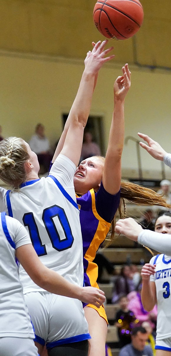 Saratoga Catholic’s Margaret Crow, center, tries for the hoop as Northville’s Leah Valovic blocks during their Section II Class D final basketball game on Saturday, March 7, 2026, at Hudson Valley Community College in Troy, N.Y. Saratoga Catholic wins 43-41.  Cindy Schultz for The Evangelist
