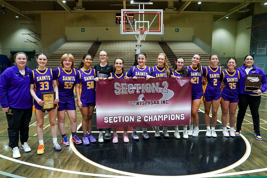 Saratoga Catholic players and coaches following their Section II Class D final basketball game win against Northville on Saturday, March 7, 2026, at Hudson Valley Community College in Troy, N.Y. Saratoga Catholic wins 43-41.  Cindy Schultz for The Evangelist